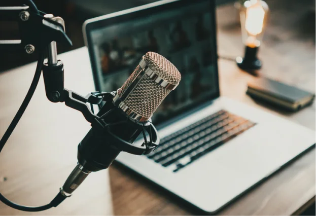 Podcast mic and laptop image